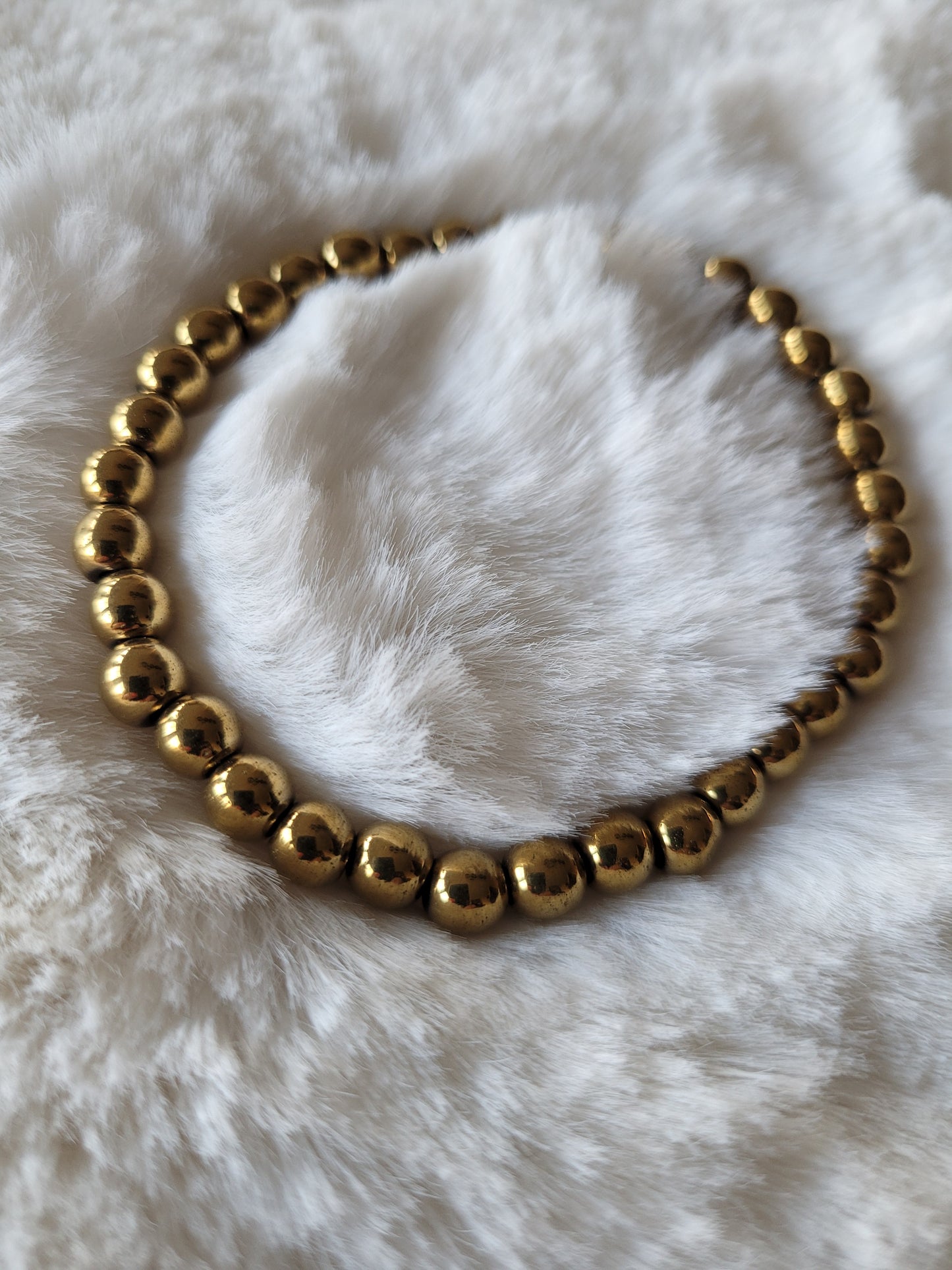 Armbandje Hematiet "Gold" 8 mm